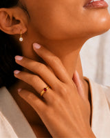 Natural red ruby ring with smooth oval bezel setting in 18K yellow gold | SARATTI