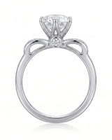 Natural round diamond engagement ring top view with diamond-set shoulders in 18K white gold | SARATTI