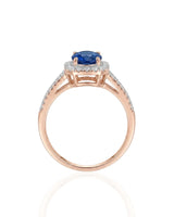 Natural royal blue sapphire ring with round diamond accents in 18K rose gold | SARATTI