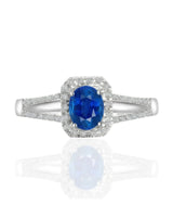 Natural royal blue sapphire ring with round diamond accents in 18K white gold | SARATTI