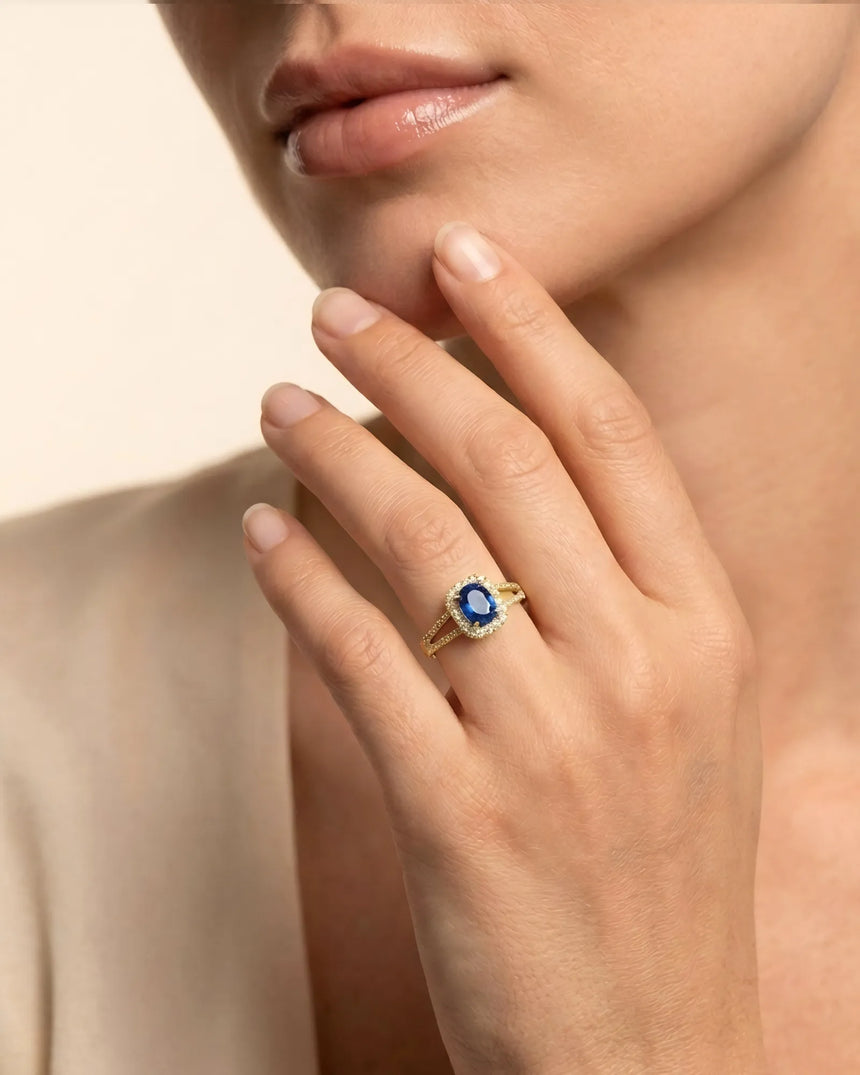 Natural royal blue sapphire ring with round diamond accents in 18K yellow gold | SARATTI