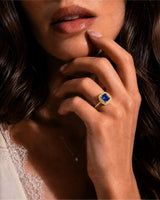 Natural unheated blue sapphire ring with round diamond accents in 18K yellow gold | SARATTI