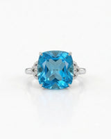 Ornate scrollwork topaz ring with diamond-accented loop shoulders in polished 18K white gold | SARATTI