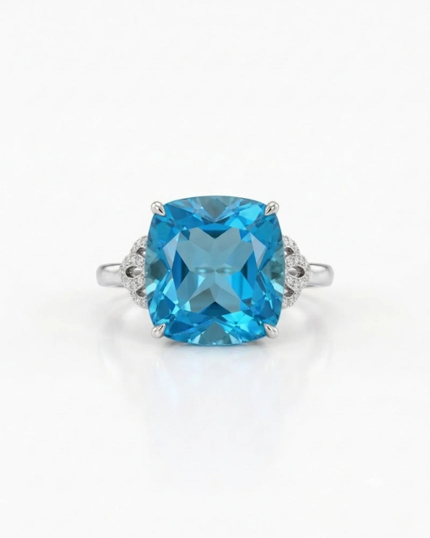 Ornate scrollwork topaz ring with diamond-accented loop shoulders in polished 18K white gold | SARATTI