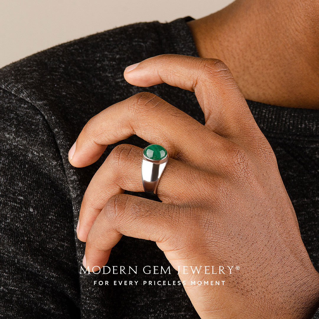 Mens emerald ring oval cabochon worn on hand in platinum | SARATTI
