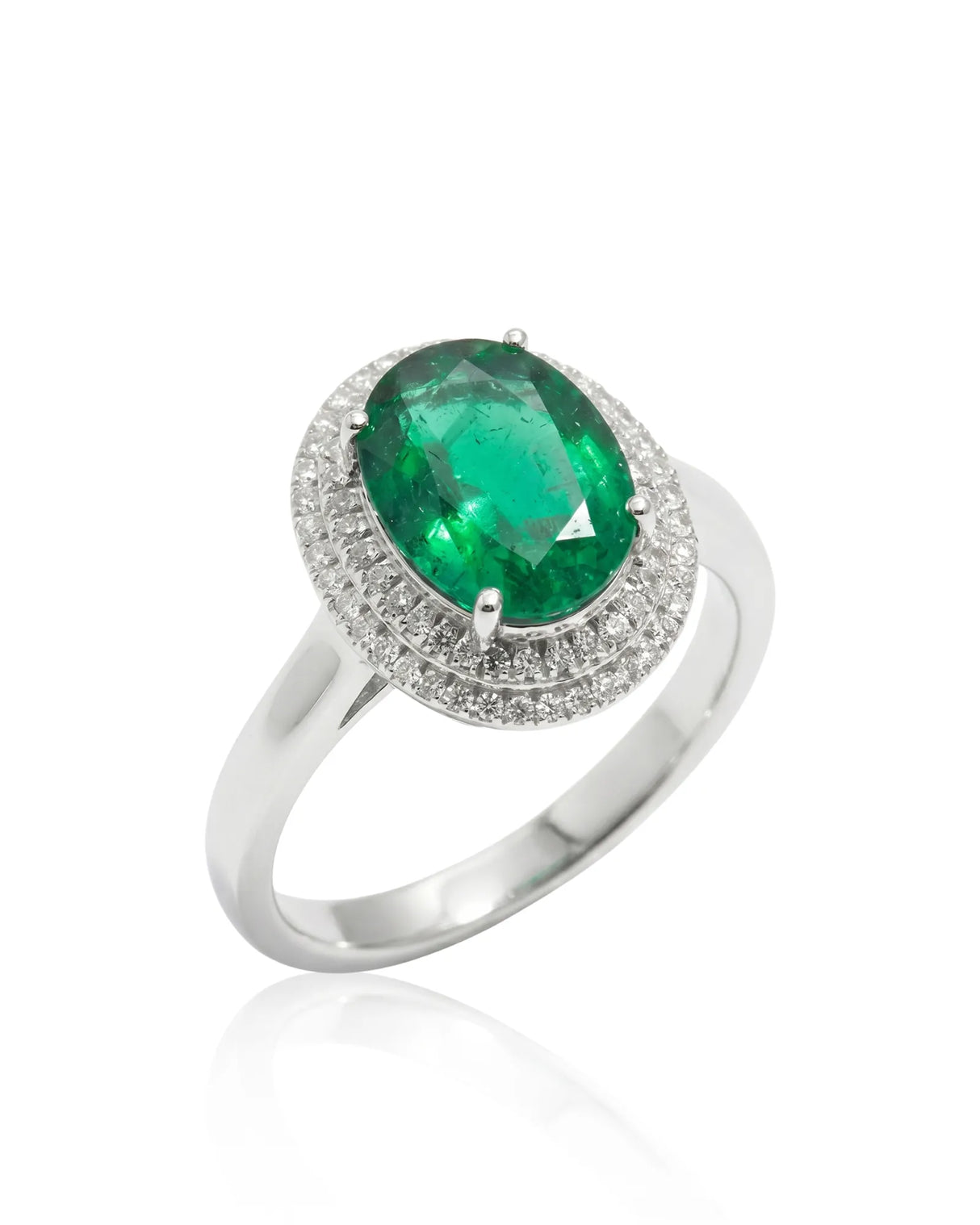 Oval Halo Eterna natural emerald and diamond ring in 18K white gold | SARATTI
