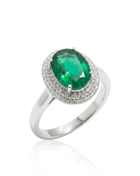 Oval Halo Eterna natural emerald and diamond ring in 18K white gold | SARATTI