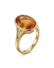 Oval Imperial Topaz split shank bezel setting ring in yellow gold | SARATTI