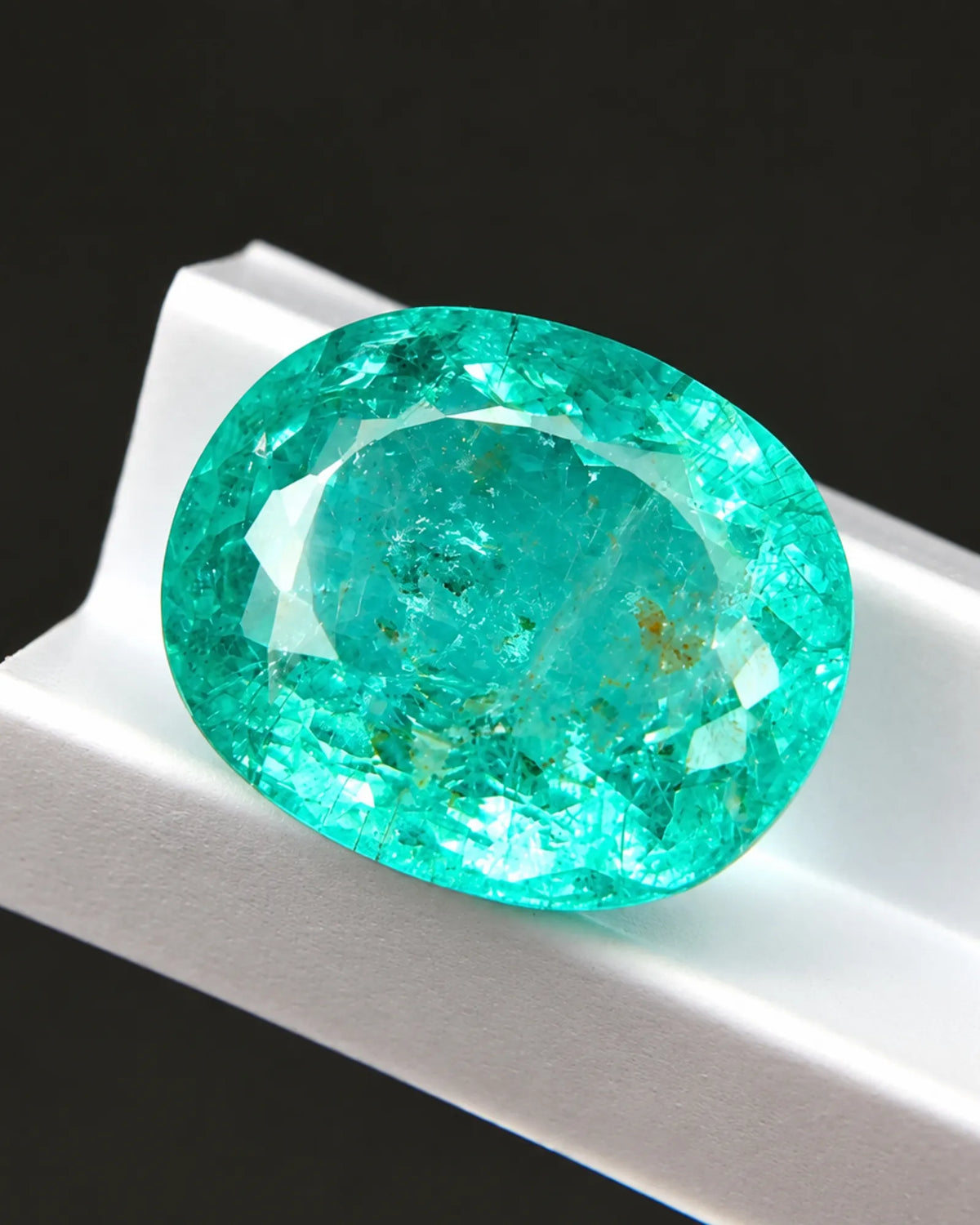 Oval Natural Tourmaline with faceted surface and blue-green colour | SARATTI
