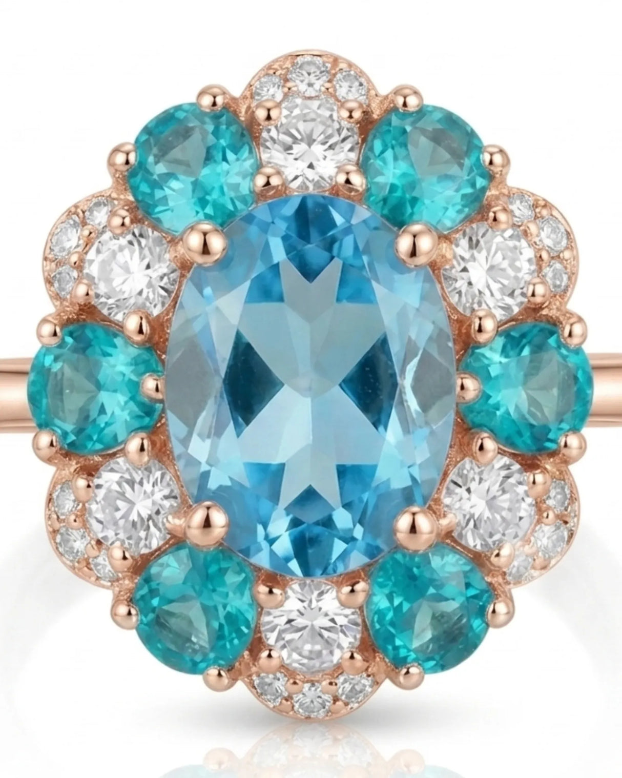 Oval Swiss Blue topaz ring framed by teal apatites and round diamonds in 18K rose gold | SARATTI