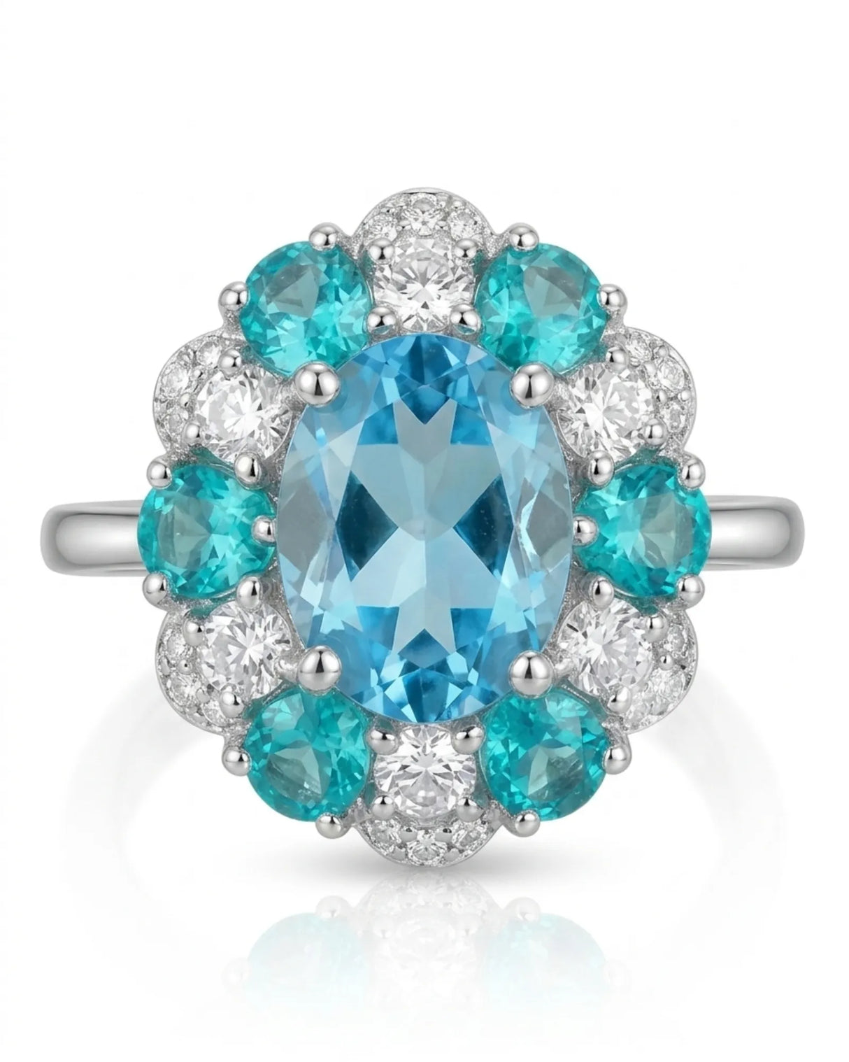 Oval Swiss Blue topaz ring framed by teal apatites and round diamonds in 18K white gold | SARATTI