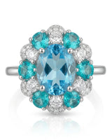 Oval Swiss Blue topaz ring framed by teal apatites and round diamonds in 18K white gold | SARATTI