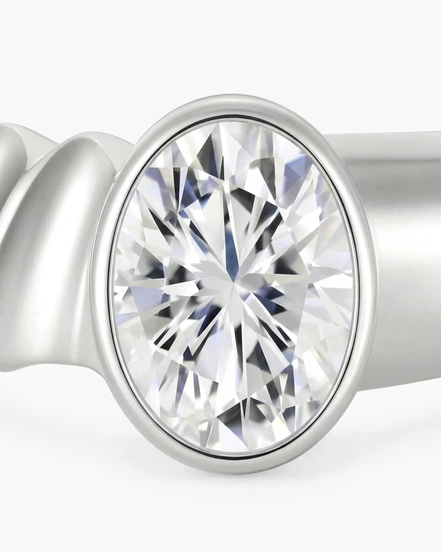 Oval bezel moissanite engagement ring for a minimalist modern proposal crafted in platinum | SARATTI