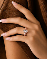 Oval bezel moissanite engagement ring for a minimalist modern proposal in 18K rose gold | SARATTI