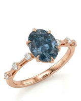 Oval blue moissanite engagement ring with round shoulder accents in 18K rose gold | SARATTI
