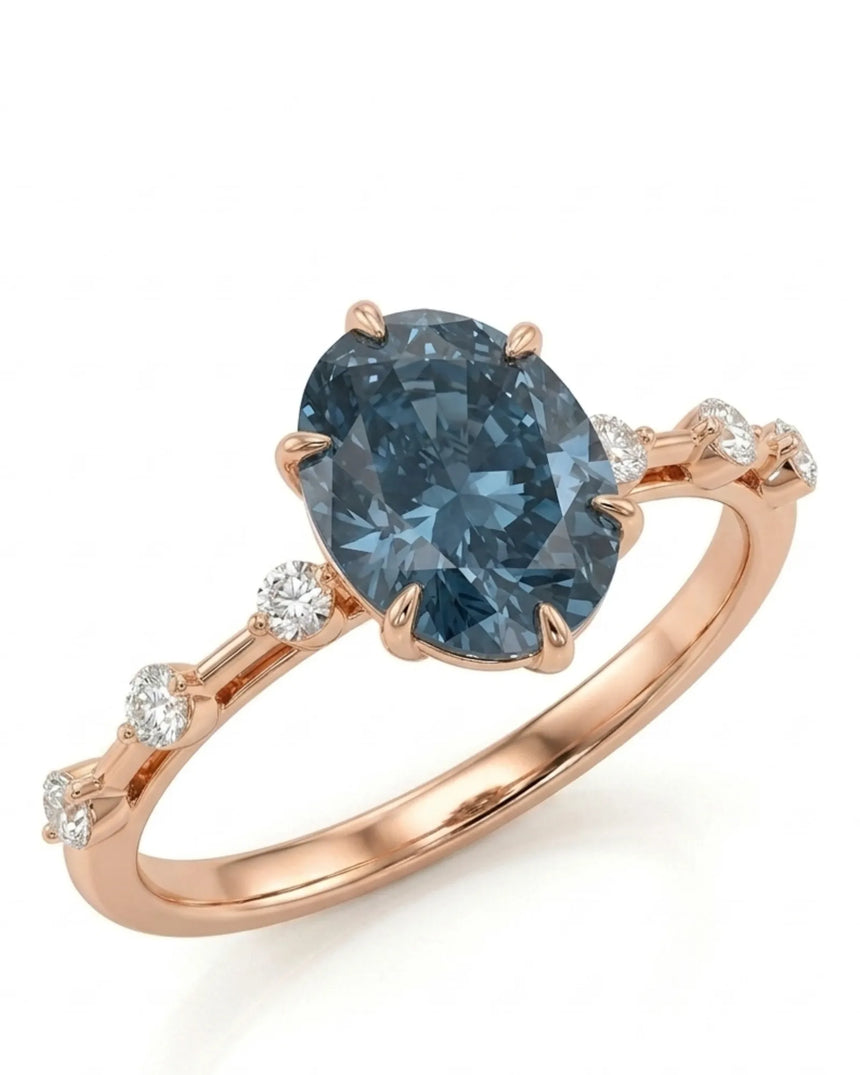 Oval blue moissanite engagement ring with round shoulder accents in 18K rose gold | SARATTI