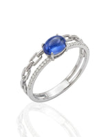 Oval blue sapphire Cuban chain ring with channel set diamonds in polished platinum | SARATTI