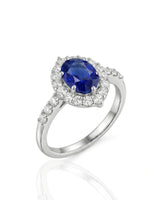 Oval blue sapphire halo ring with natural diamonds in 18K white gold | SARATTI