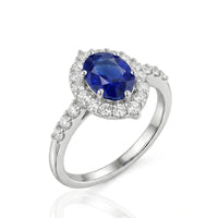 Oval Blue Sapphire and Diamond Halo White Gold Ring