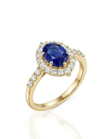 Oval blue sapphire halo ring with natural diamonds in 18K yellow gold | SARATTI