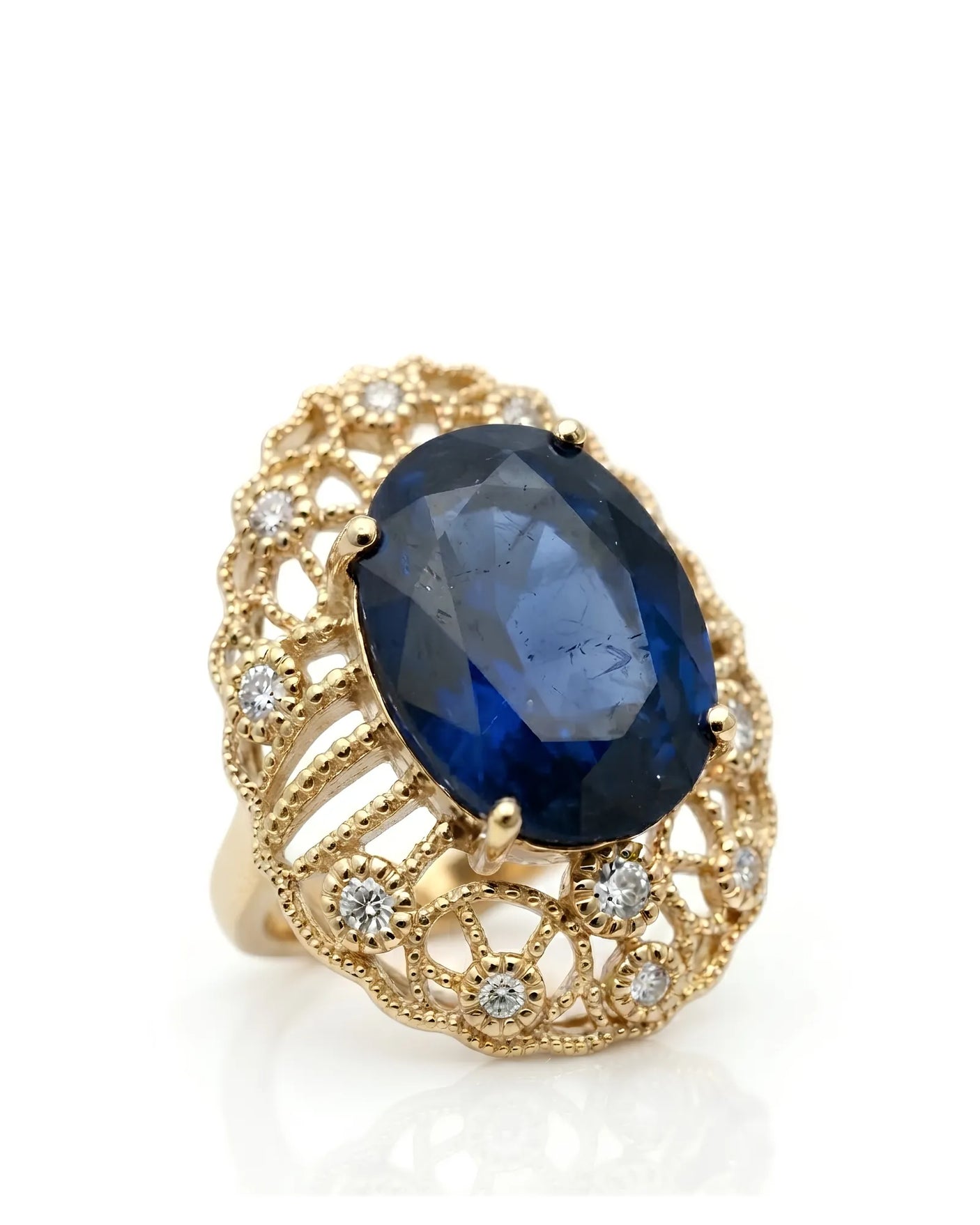 Oval blue sapphire ring with antique filigree diamond accents in 18K yellow gold | SARATTI