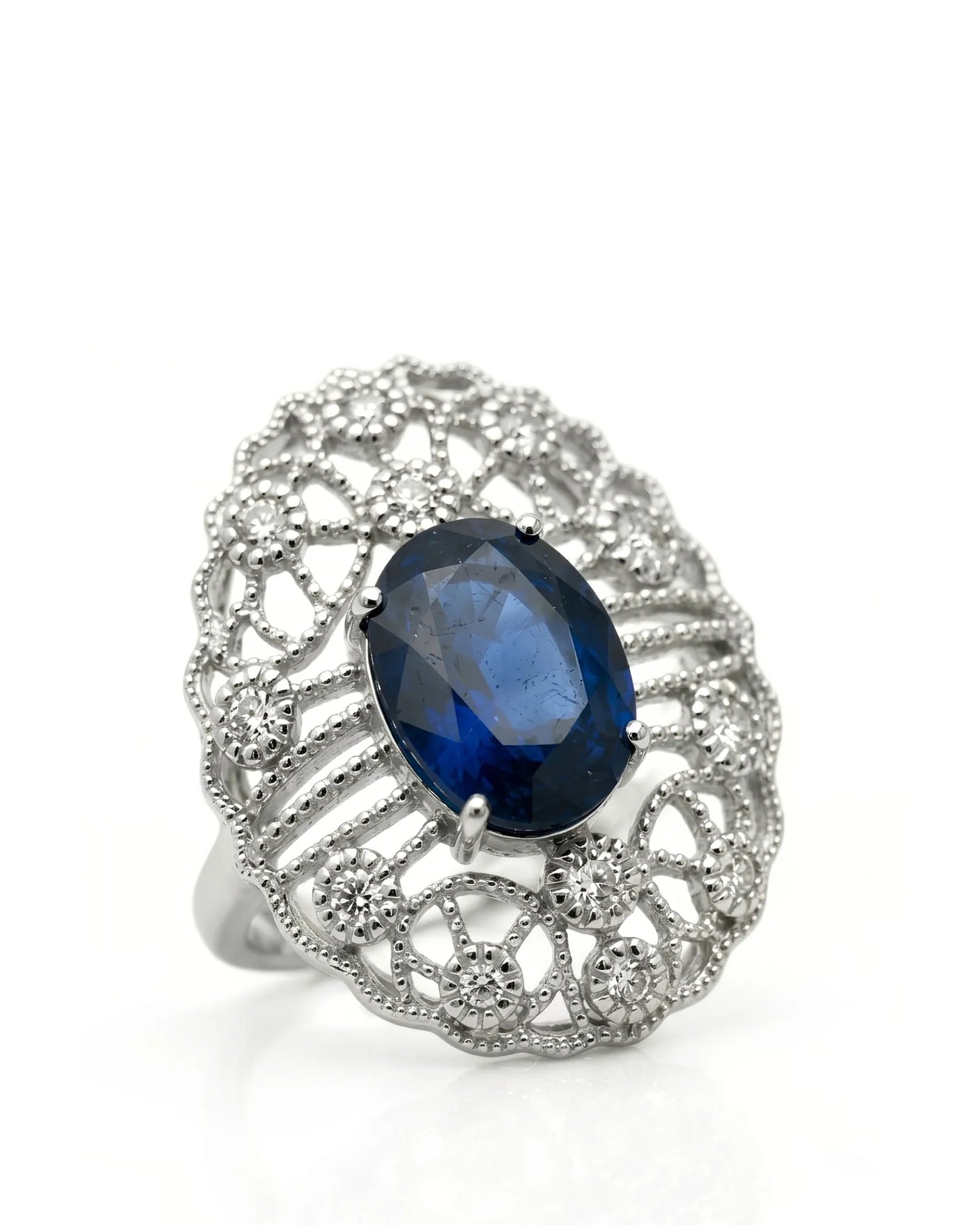 Oval blue sapphire ring with antique filigree diamond accents in platinum | SARATTI