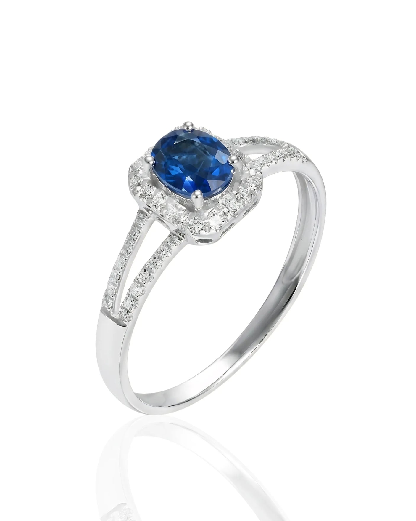 Oval blue sapphire ring with diamond halo and split shank in 18K white gold | SARATTI