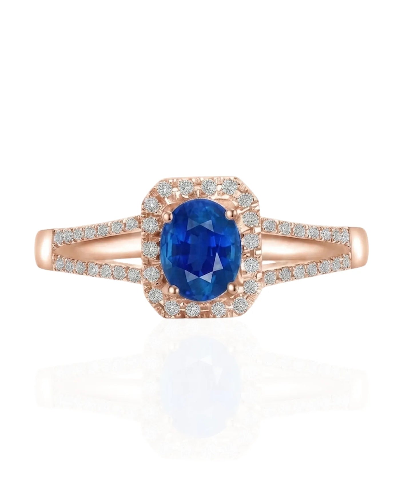 Oval blue sapphire ring with diamond halo and split shank in polished platinum | SARATTI