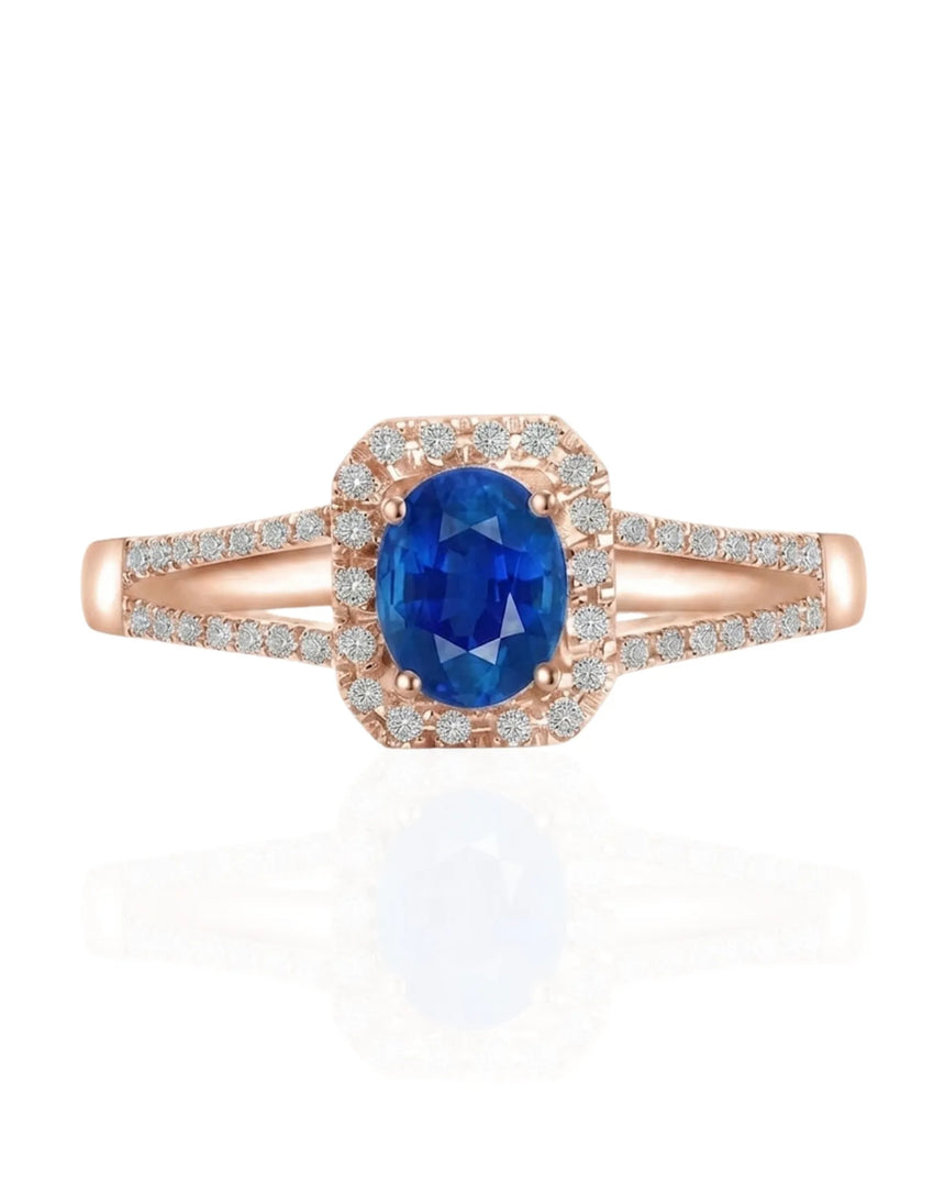 Oval blue sapphire ring with diamond halo and split shank in polished platinum | SARATTI