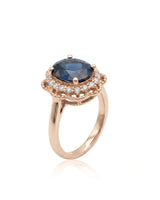 Oval blue sapphire ring with scalloped diamond halo in 18K rose gold | SARATTI
