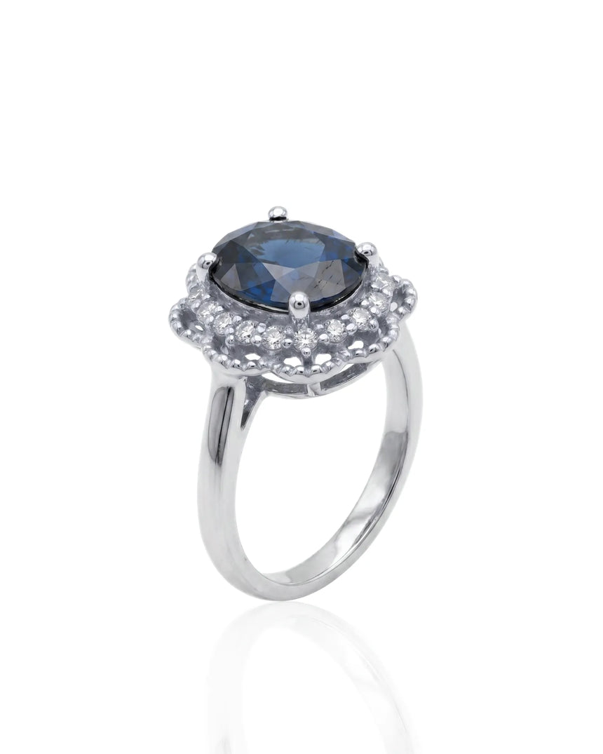 Oval blue sapphire ring with scalloped diamond halo in platinum | SARATTI