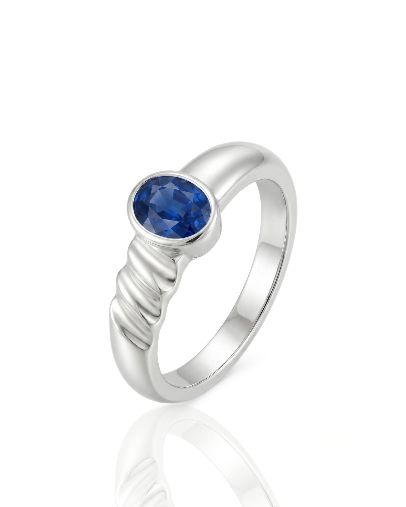 Oval blue sapphire solitaire ring with bezel setting and grooved 18K White Gold band | SARATTI