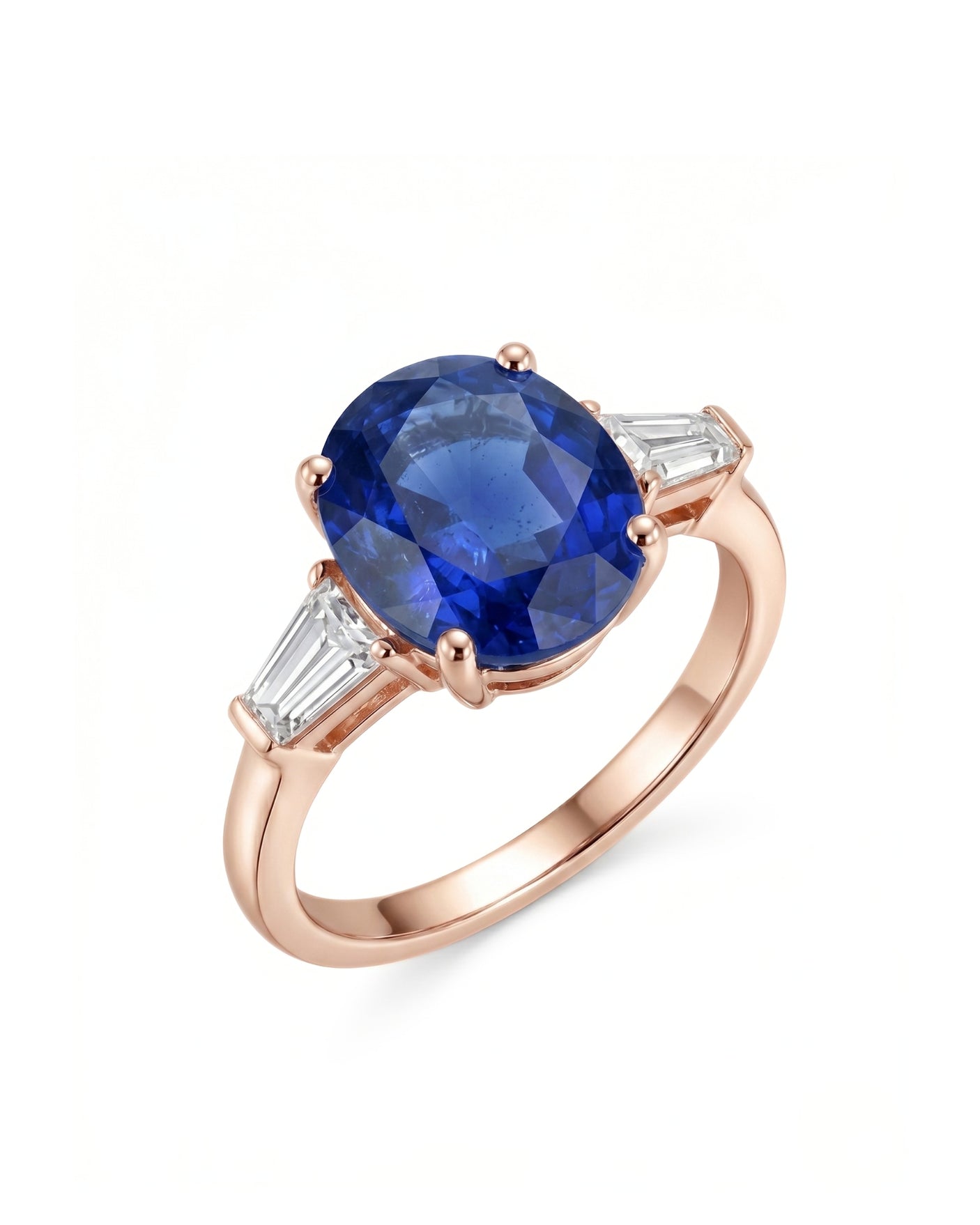 Oval blue sapphire three-stone ring with baguette diamond accents in 18K rose gold | SARATTI