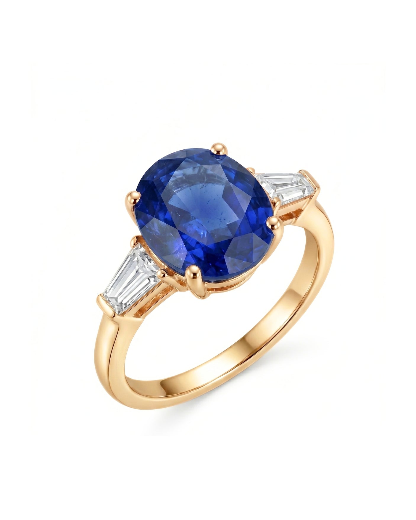 Oval blue sapphire three-stone ring with baguette diamond accents in 18K yellow gold | SARATTI