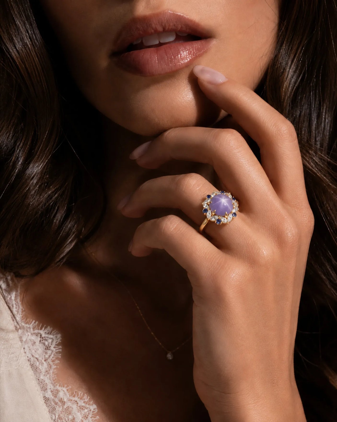 Oval cabochon natural star sapphire ring with blue sapphire accents in 18K yellow gold | SARATTI
