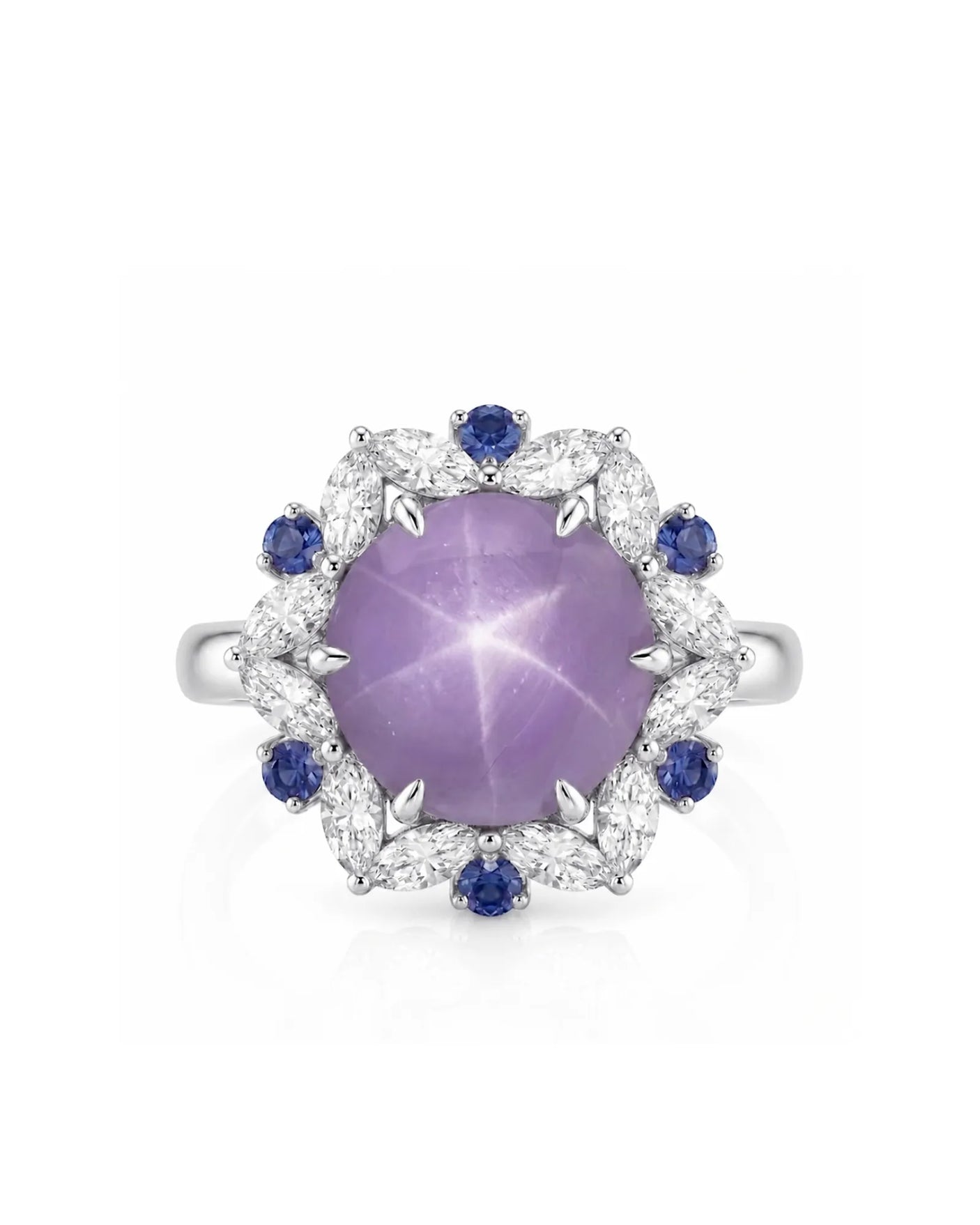 Oval cabochon natural star sapphire ring with blue sapphire accents in platinum | SARATTI
