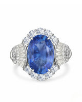 Oval cornflower blue sapphire ring with brilliant diamond halo in enduring platinum | SARATTI