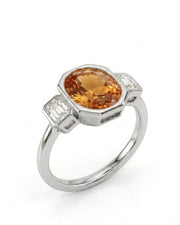 Oval cut Natural Imperial Topaz three-stone bezel setting in platinum | SARATTI