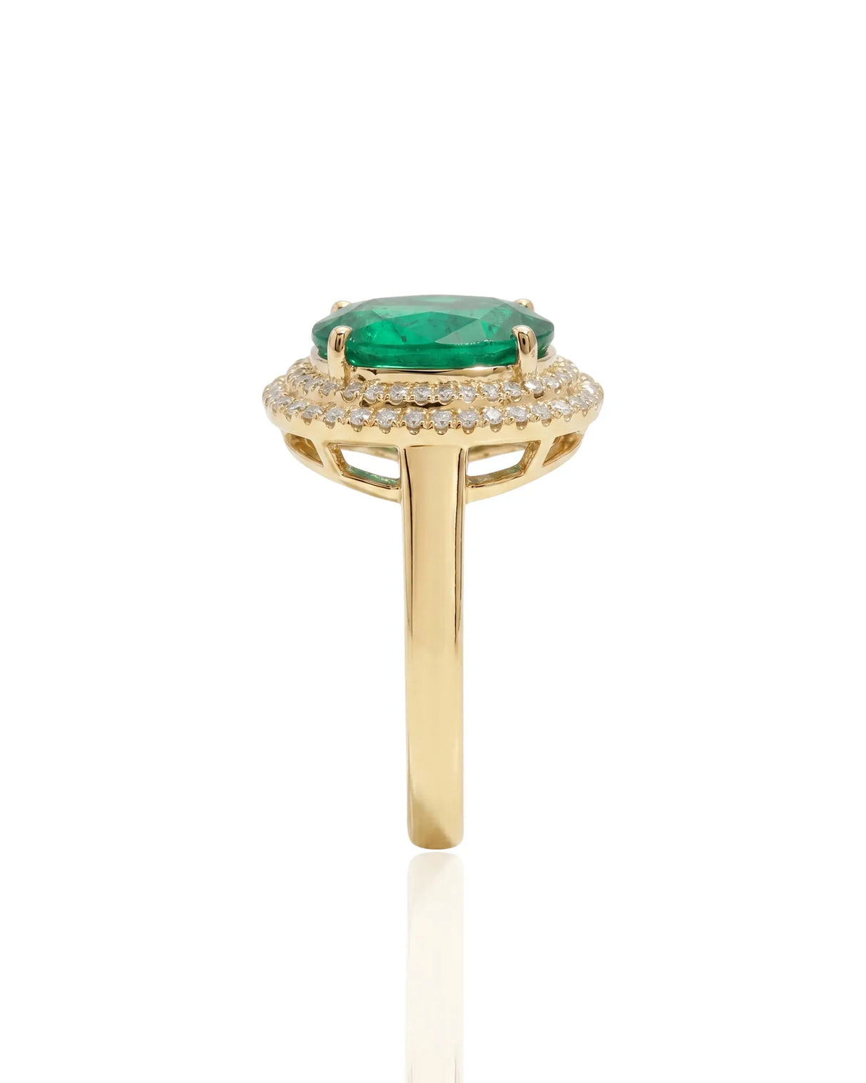 Oval cut natural emerald halo ring with diamond accents in yellow gold | SARATTI