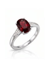 Oval deep red garnet ring with tapered diamond shoulders in 18K white gold | SARATTI