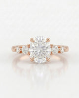 Oval five stone moissanite engagement ring for a romantic proposal in 18K rose gold | SARATTI