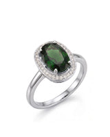 Oval green tourmaline ring with diamond halo in 18K white gold | SARATTI