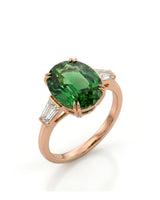 Oval green tourmaline ring with emerald-cut diamond side stones in 18K rose gold | SARATTI