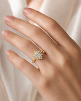 Oval halo moissanite engagement ring for a warm romantic proposal in 18K yellow gold | SARATTI