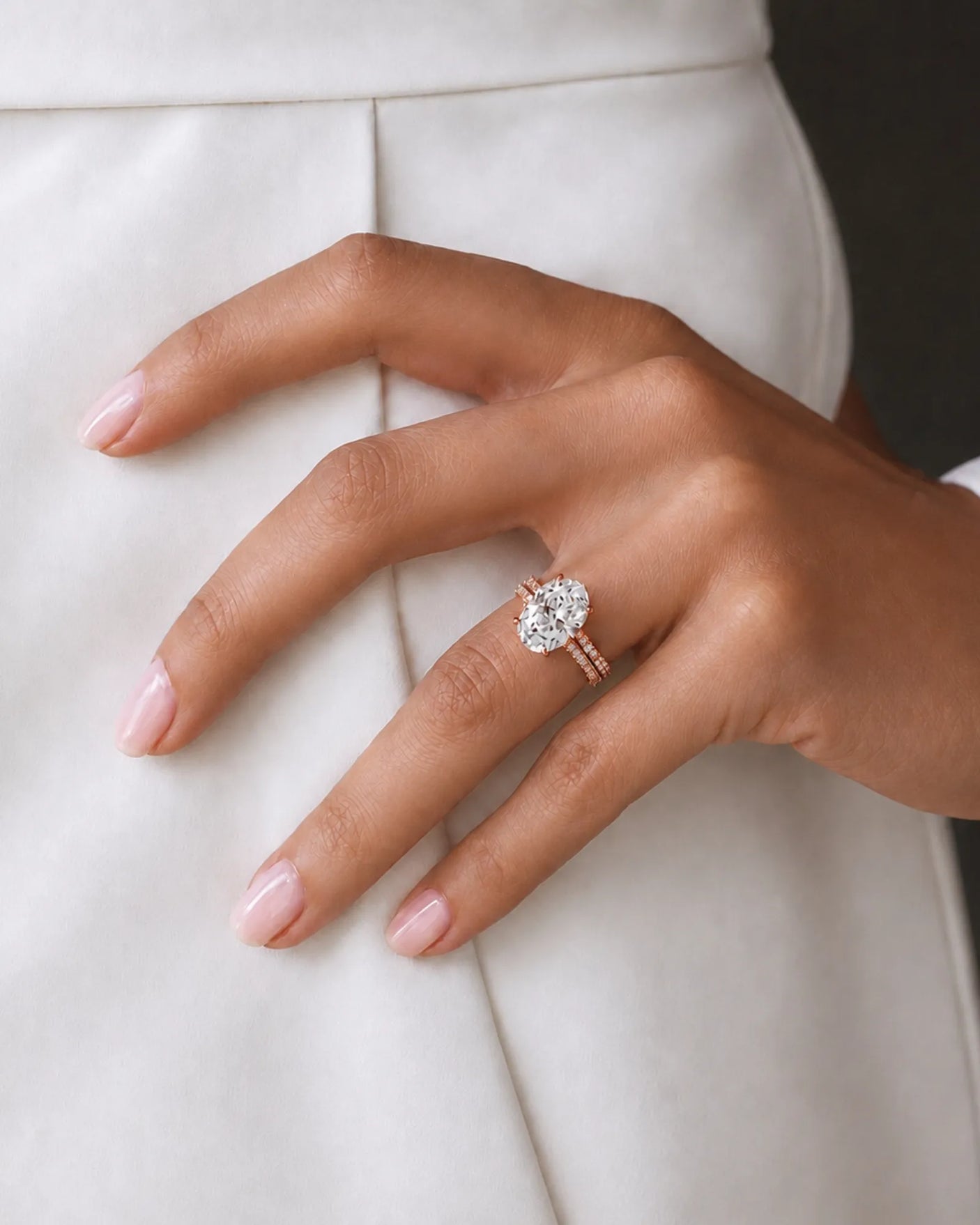 Oval moissanite engagement and wedding ring set with hidden halo crafted in 18K rose gold | SARATTI