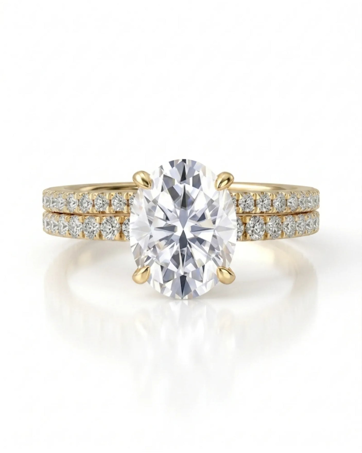 Oval moissanite engagement and wedding ring set with hidden halo crafted in 18K yellow gold | SARATTI
