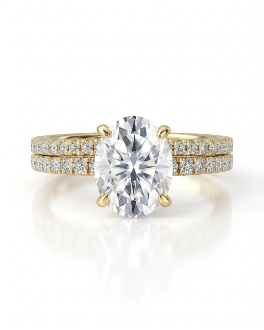 Oval moissanite engagement and wedding ring set with hidden halo crafted in 18K yellow gold | SARATTI
