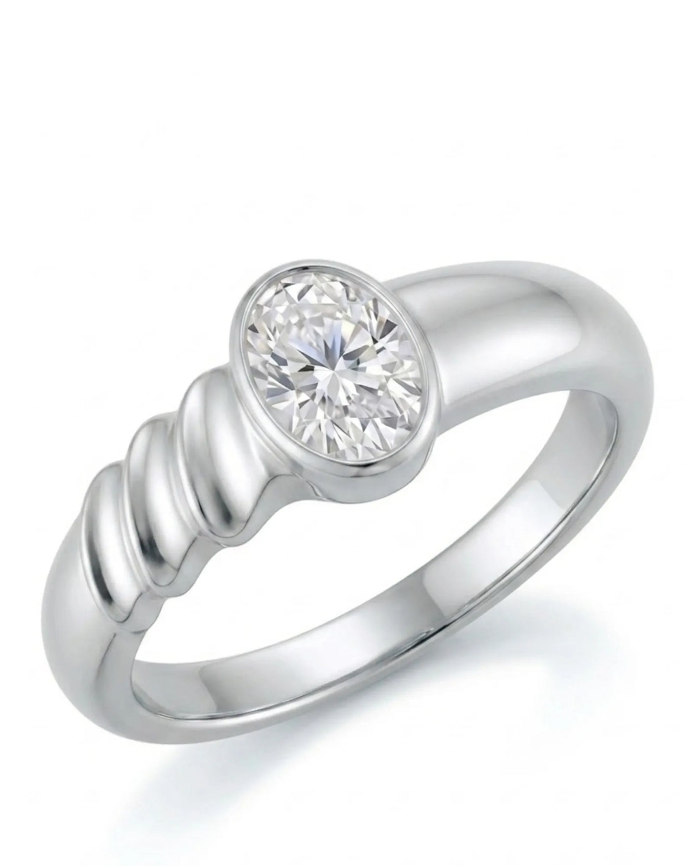 Oval moissanite engagement ring with bezel setting and sculpted wave band crafted in platinum | SARATTI