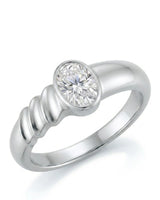 Oval moissanite engagement ring with bezel setting and sculpted wave band crafted in platinum | SARATTI