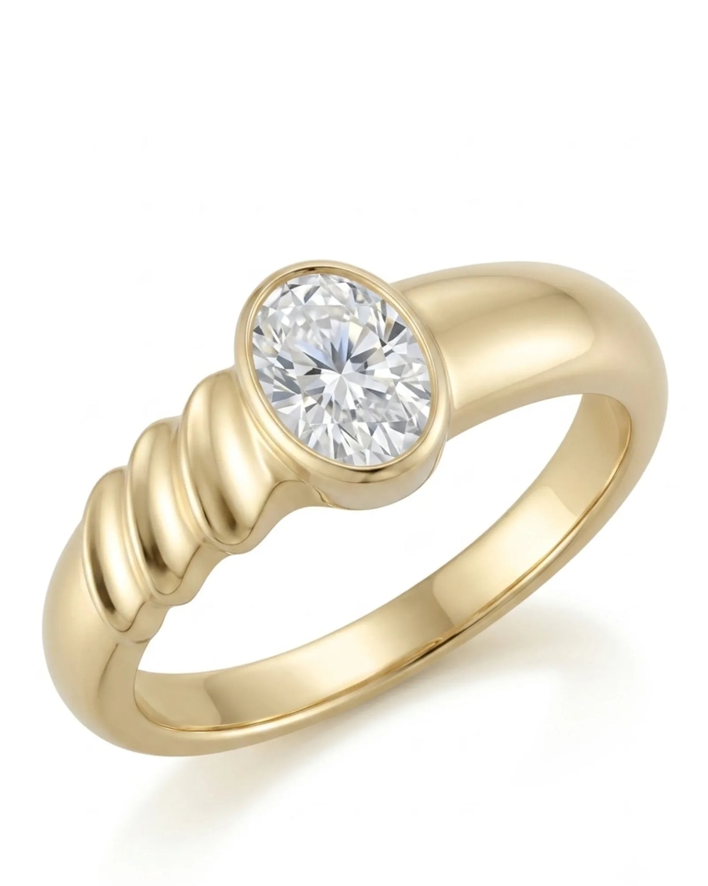 Oval moissanite engagement ring with bezel setting and sculpted wave band in 18K yellow gold | SARATTI